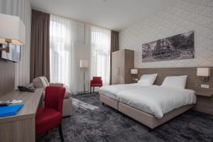 Ліжко або ліжка в номері Fletcher Hotel-Restaurant Middelburg