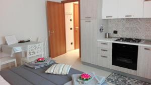 Kuchyň nebo kuchyňský kout v ubytování Residenze Principe Amedeo