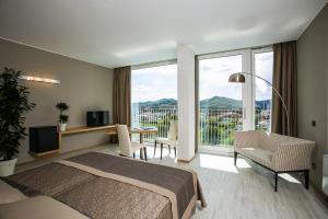 Voodi või voodid majutusasutuse Hotel Abano Astoria toas