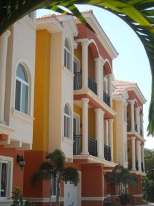 a building with orange and yellow at Beach and Bay MediterraneanTownhouse in St. Pete Beach
