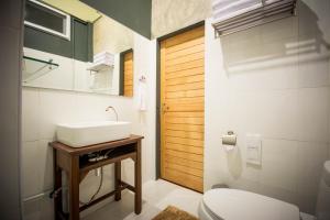 a bathroom with a sink and a toilet at The Corner's unique house in Chiang Mai +36 photos