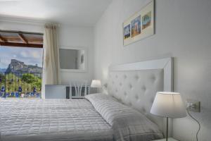 Postel nebo postele na pokoji v ubytování Hotel Parco Cartaromana