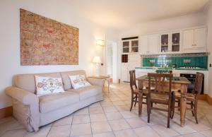 a living room with a couch and a table at Tenuta Del Poggio Antico in Ischia
