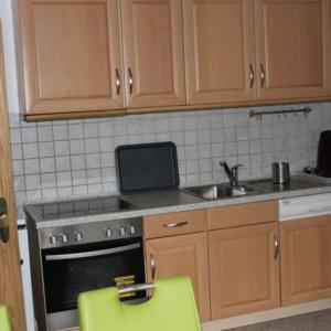 Kuchyň nebo kuchyňský kout v ubytování Ferienwohnung Regenbogen
