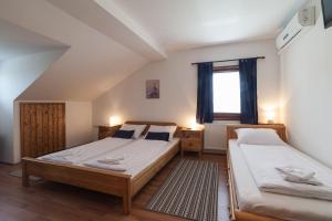 Postel nebo postele na pokoji v ubytování Breza Guesthouse