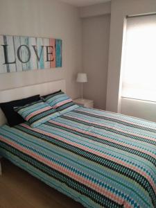 Łóżko lub łóżka w pokoju w obiekcie Apartments Campello