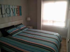 Łóżko lub łóżka w pokoju w obiekcie Apartments Campello