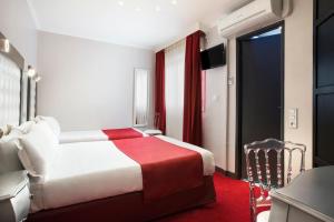 Letto o letti in una camera di Grand Hôtel Amelot