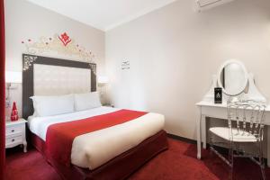 Letto o letti in una camera di Grand Hôtel Amelot