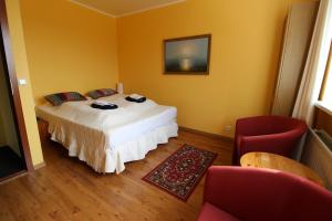 Postel nebo postele na pokoji v ubytování Guesthouse Steinsholt