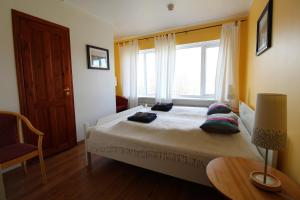 Postel nebo postele na pokoji v ubytování Guesthouse Steinsholt