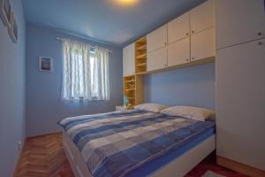 Postel nebo postele na pokoji v ubytování Apartment Marty