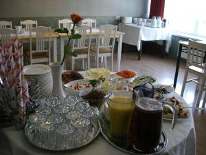 a table with food and drinks on top of it at Sõrve Guest House in Salme