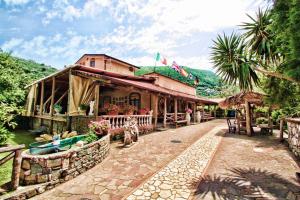 a resort with a building in the middle of a street at Agriturismo La Chiana in Vico Equense