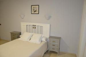 Säng eller sängar i ett rum på Hotel Balcón de Cazorla
