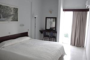 Postel nebo postele na pokoji v ubytování Hotel Marko