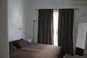 Postel nebo postele na pokoji v ubytování Hotel Marko
