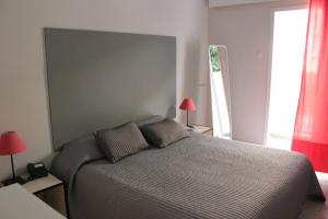 Postel nebo postele na pokoji v ubytování Hotel Marko