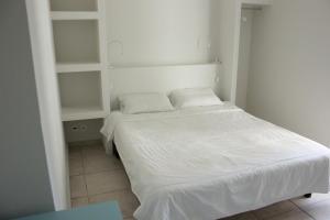 Postel nebo postele na pokoji v ubytování Hotel Marko