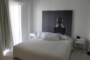 Postel nebo postele na pokoji v ubytování Hotel Marko