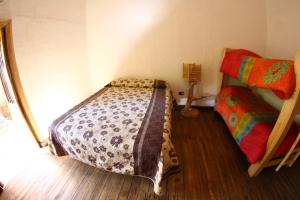 Postel nebo postele na pokoji v ubytování Cabaña hostal Ema