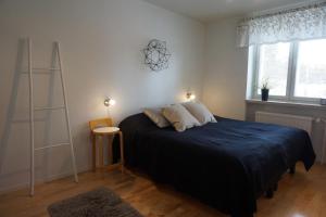 Postel nebo postele na pokoji v ubytování Ounasvaara Arctic Suite