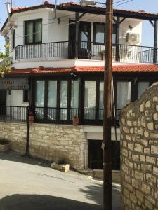 a large building with a lot of windows at Xenios Guesthouse in Koilani