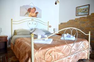 
A bed or beds in a room at Il Baglio
