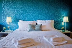 Posteľ alebo postele v izbe v ubytovaní Ornella Beach Resort & Villas