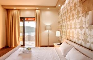 Posteľ alebo postele v izbe v ubytovaní Ornella Beach Resort & Villas