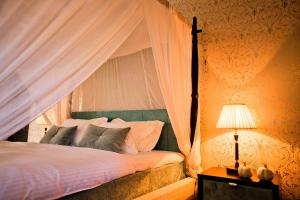 Posteľ alebo postele v izbe v ubytovaní Ornella Beach Resort & Villas