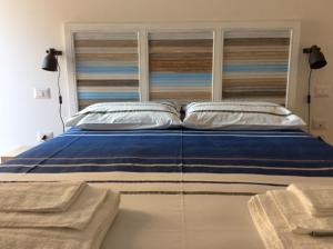 Postel nebo postele na pokoji v ubytování A Casa di Leo