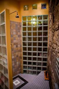 a bathroom with a shower with a toilet in it at Epicurean Clerk Apartment in Edinburgh