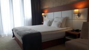 Postel nebo postele na pokoji v ubytování Hotel Porto In