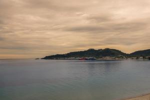 an island in the middle of a large body of water at Hotel Villa Nisteri in Limenas