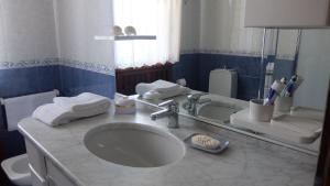 Koupelna v ubytování La Casa di Enrico + 18 fotografií