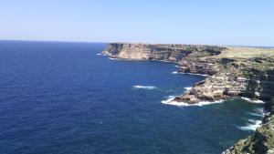 an aerial view of the ocean and a rocky coast at La Casa Dei Delfini in Lampedusa