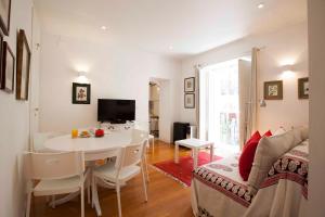 a living room with a table and a dining room at Lovely Apartment In Sintra in Sintra