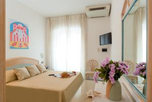 Voodi või voodid majutusasutuse Appartamenti Baia di Citara toas