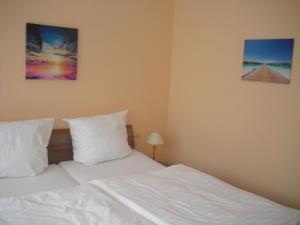 Postel nebo postele na pokoji v ubytování Hotel Feilen-Wolff