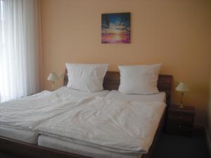 Postel nebo postele na pokoji v ubytování Hotel Feilen-Wolff