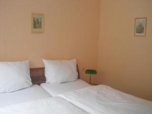 Postel nebo postele na pokoji v ubytování Hotel Feilen-Wolff