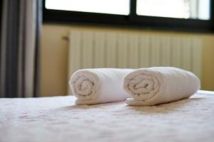 Postel nebo postele na pokoji v ubytování Hotel Mazzurco