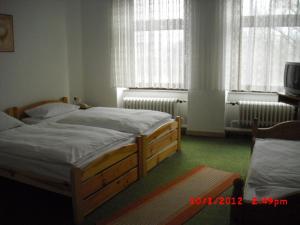Postel nebo postele na pokoji v ubytování Hotel Feilen-Wolff