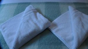 a close up of a white shirt on a bed at Bay Lodge in Birchington