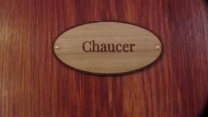 a sign on a wooden door with the word chamber at Bay Lodge in Birchington