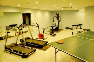 a fitness room with a gym with tread machines at Leivatho Hotel in Svoronata