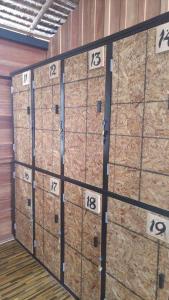 a group of four wooden boxes in a room at Cafe del sunshine in Ko Chang