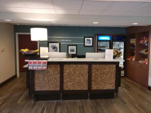 a lobby with a counter in a store at Kitchener Inn & Suites in Kitchener