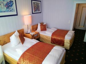 Voodi või voodid majutusasutuse Alexa Hotel toas